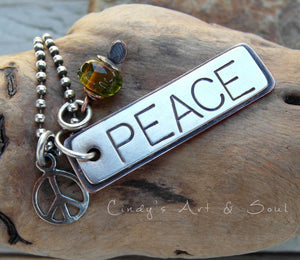 Handmade necklace with a bold PEACE loving charm. Peace sign and artist handmade lampwork bead. Designer Jewelry. 